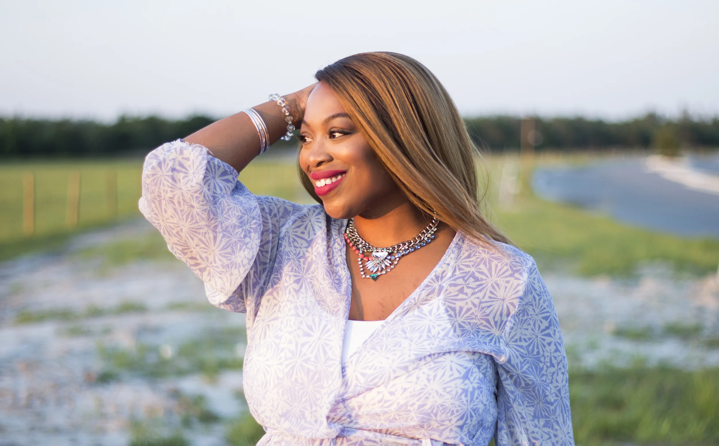 This statement necklace adds a touch of glamour to this otherwise casual ensemble. Purchase one like it here .