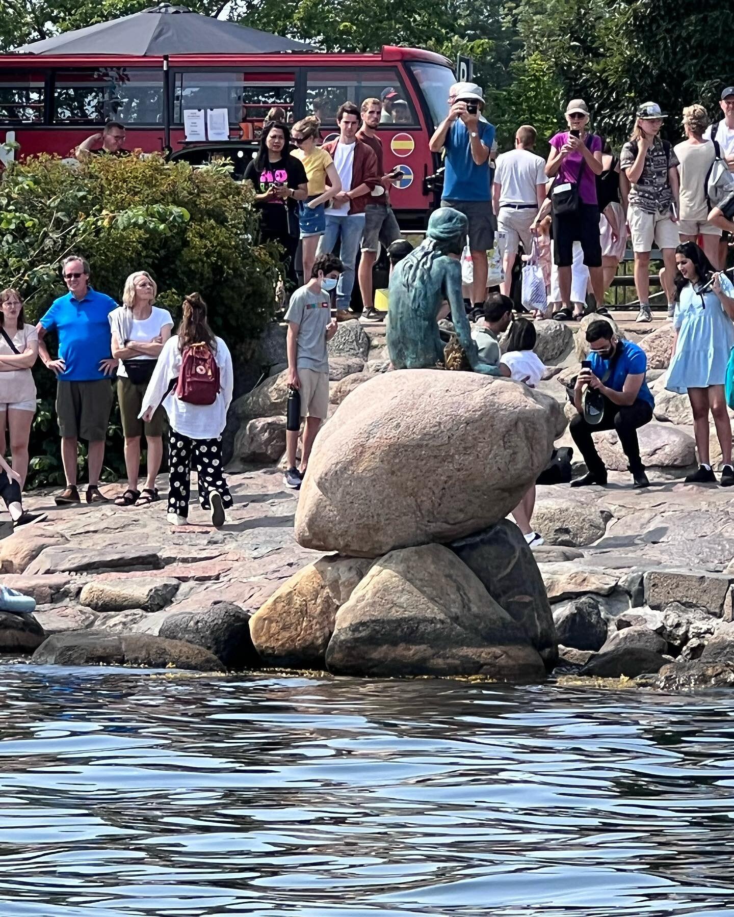 The back of The Little Mermaid statue (it&rsquo;s all you get when you take a harbor cruise), having a little chat with the man himself, Hans Christian Andersen, walking through Nyhavn, and my own little P&oslash;lser cart (hotdog).