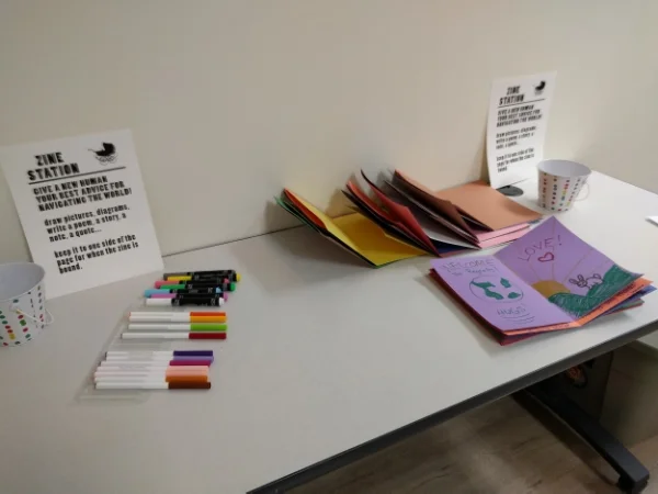 Zine station that was set up for guests to leave advice for any new humans joining this world.