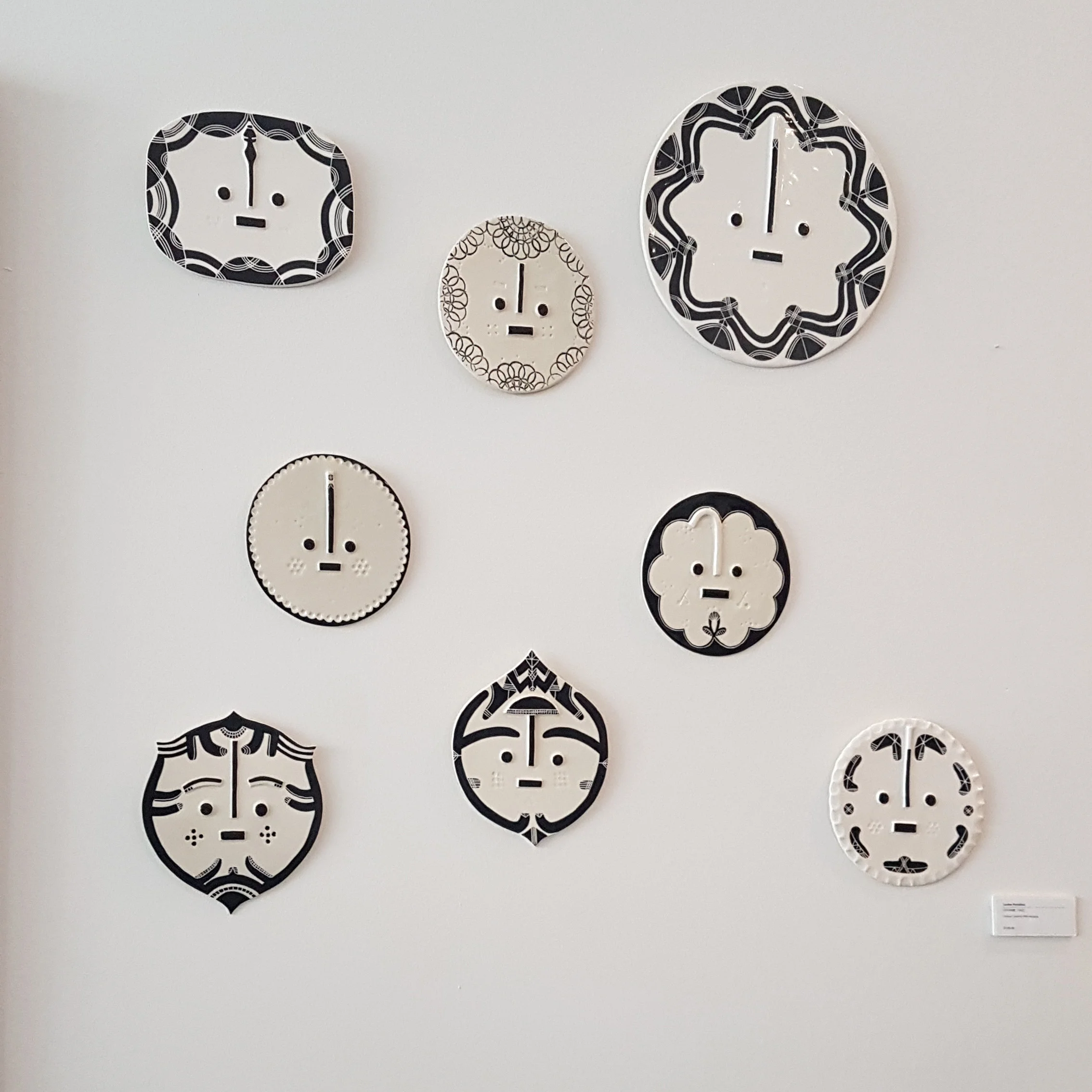 Ceramic faces by Louise Kyriakou
