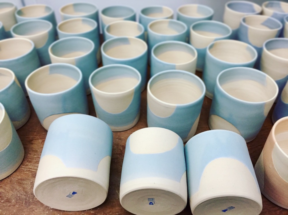  Glazed and finished pots in light blue. 