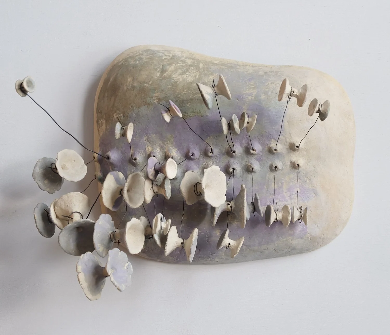 Reclining Column, 2024. Ceramic and wire, 16 x 21 x 10 inches (41 x 53 x 25 cm)