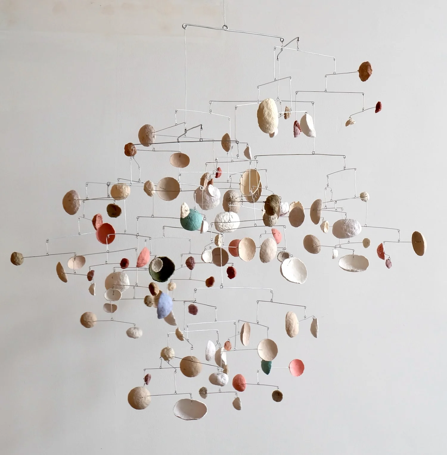 Wiggle-Under. Black-Dot BAAB-BAA, 2024. Paper pulp and wire, 40 x 40 x 40 inches (102 x 102 x 102 cm)