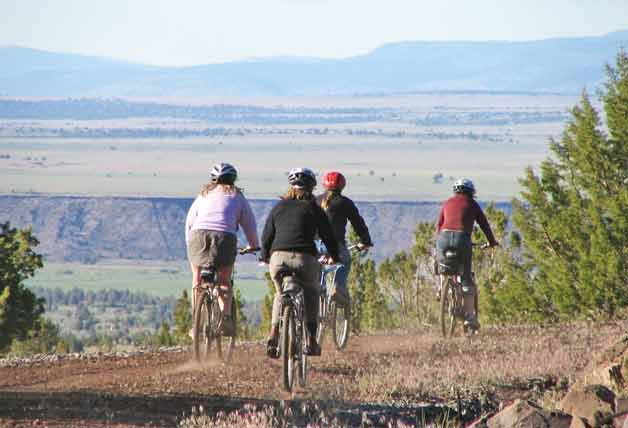 Bikers descending Hairpin Curve