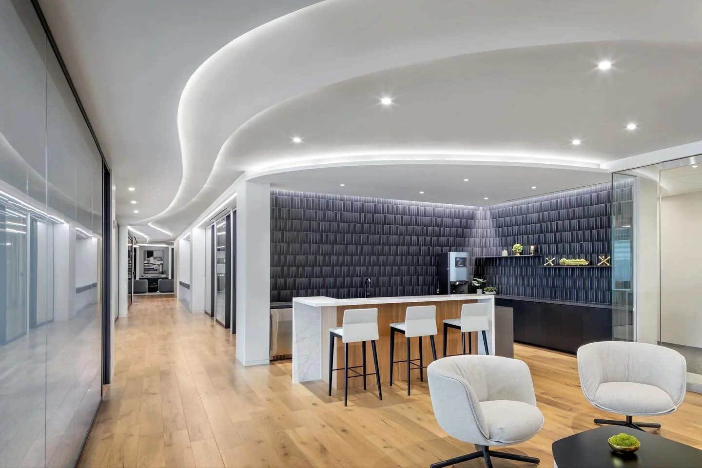 Lockwood, Andrews, &amp; Newnam&rsquo;s brand-new 38,000 SF office space is vibrant and stylish, with a playful yet refined design. The curved ceiling lighting connects the break room with the rest of the area, creating a cohesive flow. We love how t