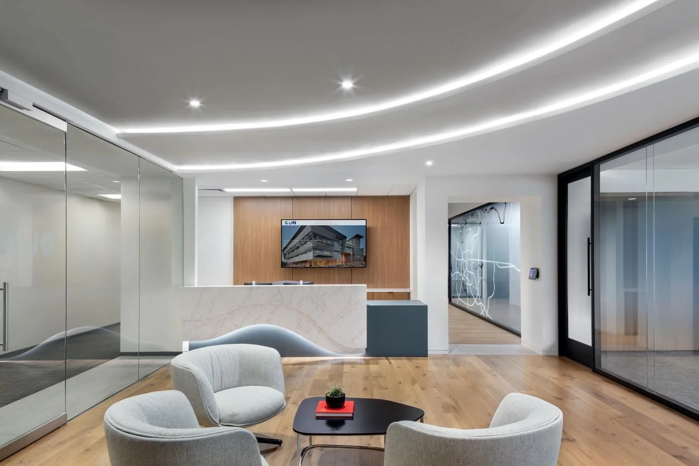 Upon entering the suite, guests are welcomed by a reception area paired with a sleek coffee bar, setting a warm and inviting tone to LAN&rsquo;s 38,000 SF space. 

A key feature of their office is the custom frosted-glass freeway map of Houston that 