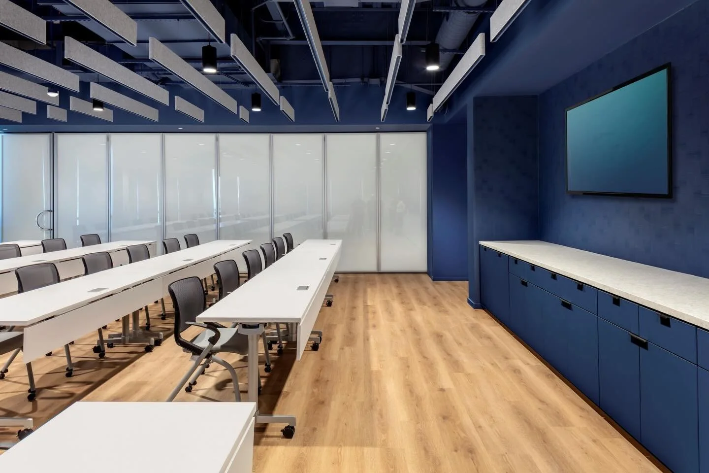 Taking a tour inside the 86,000 SF headquarters in Friendswood, there is much to see. Starting off with the 48-seat training center! This area has a set of partitions that can be closed or open to reveal their kitchen. Equipped with their blue brandi