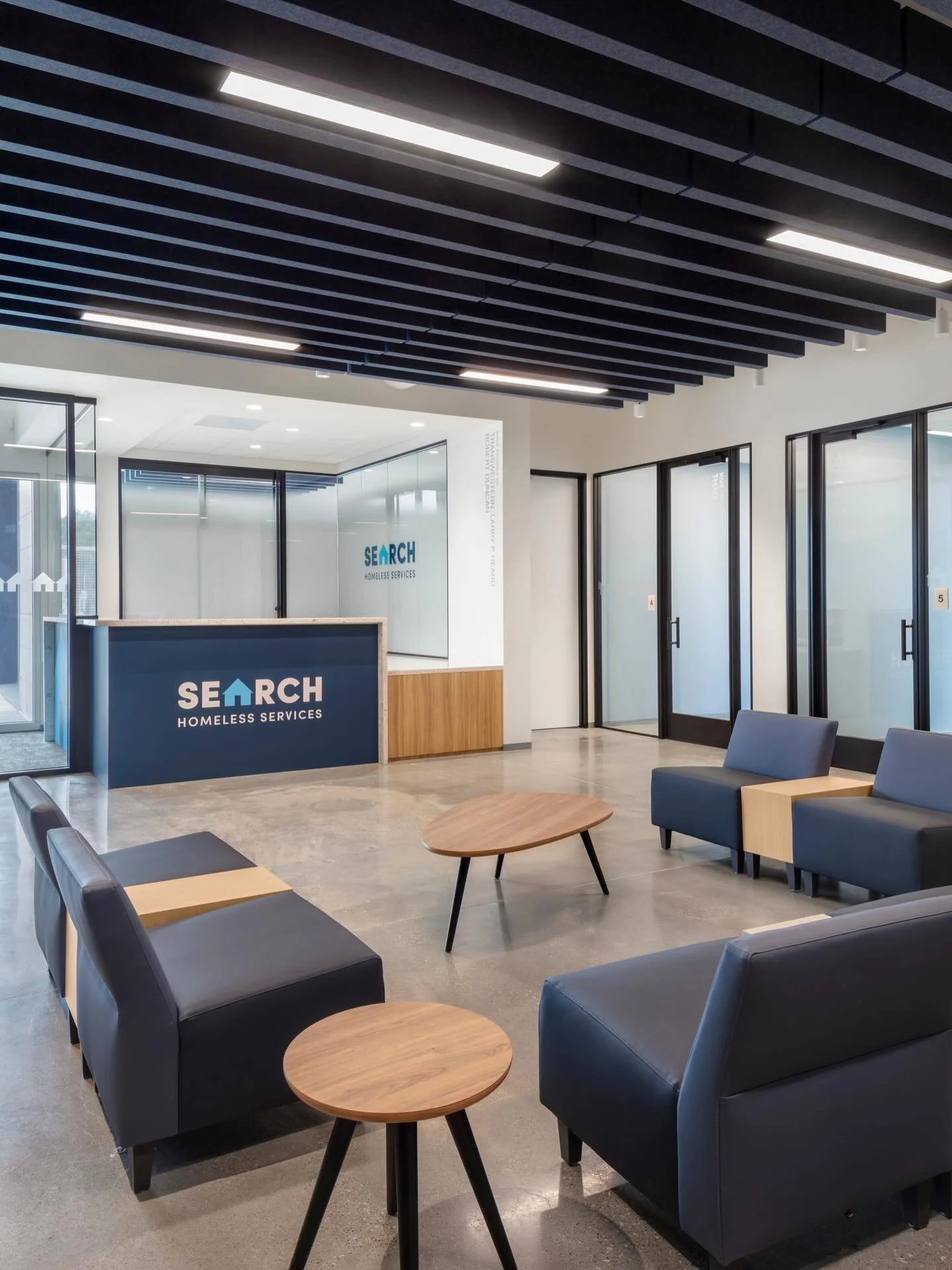There&rsquo;s more to discover at SEARCH Homeless Services. On the ground level, an additional client waiting area is designed with color branded furnishings. Moving up to the second floor, long corridors are lined with impactful graphics that guide 
