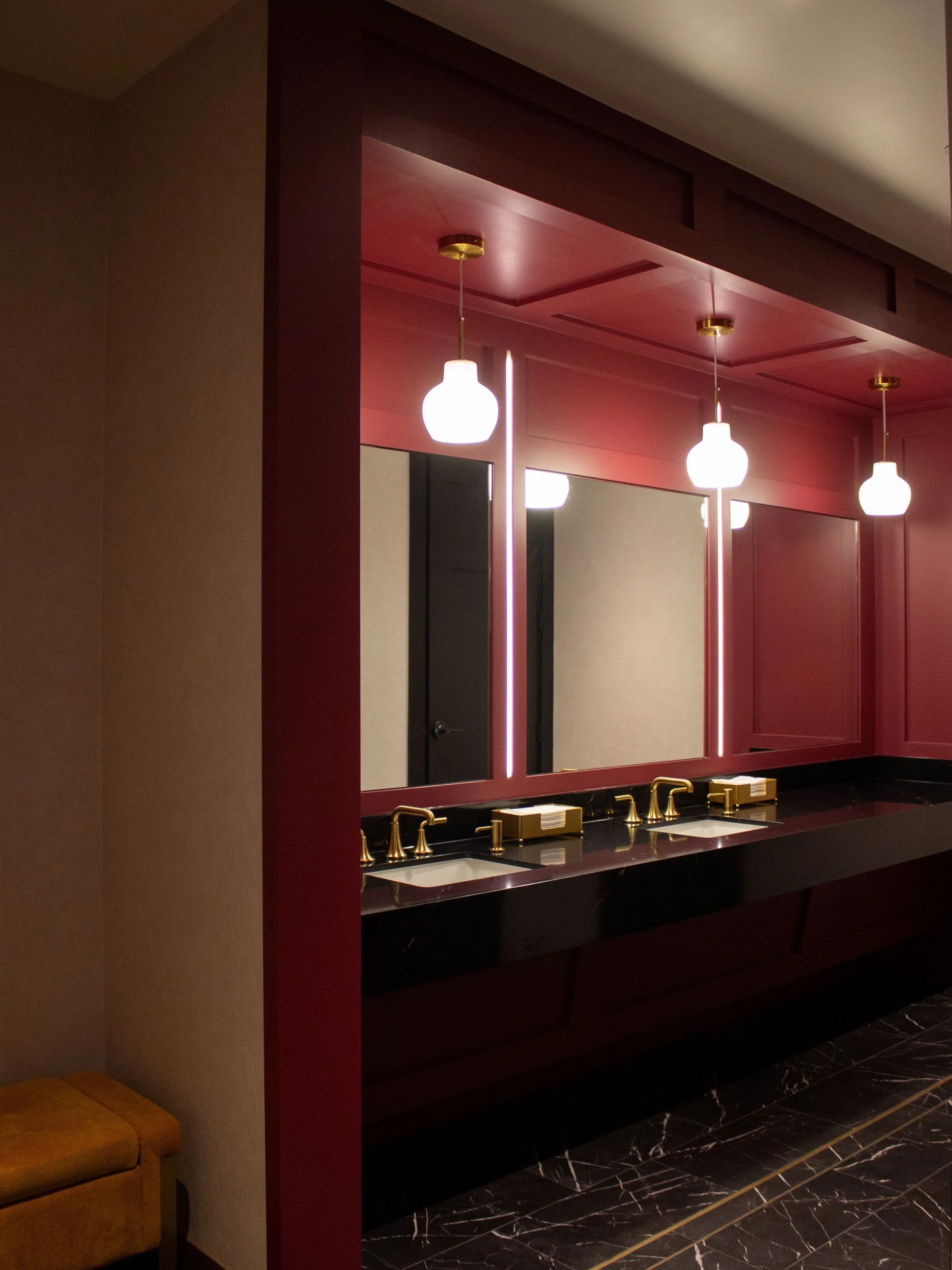 The bold character of The Chef&rsquo;s Table River Oaks carries through every detail, even the bathroom. Dark cherry red, custom artwork in each stall, and black marble makes every corner into a photo-worthy moment 🍒 📸