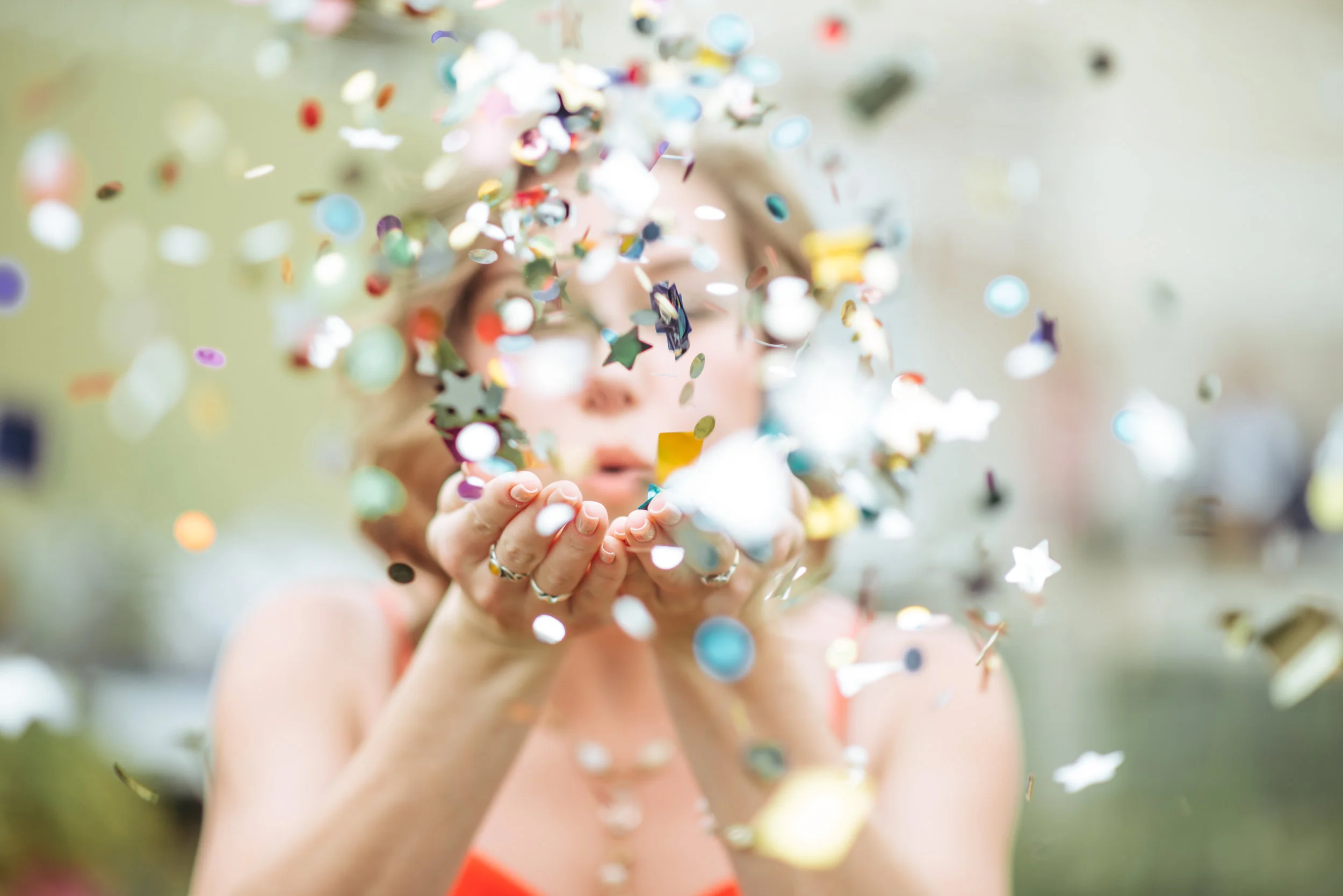 Girl Blowing Confetti.jpg