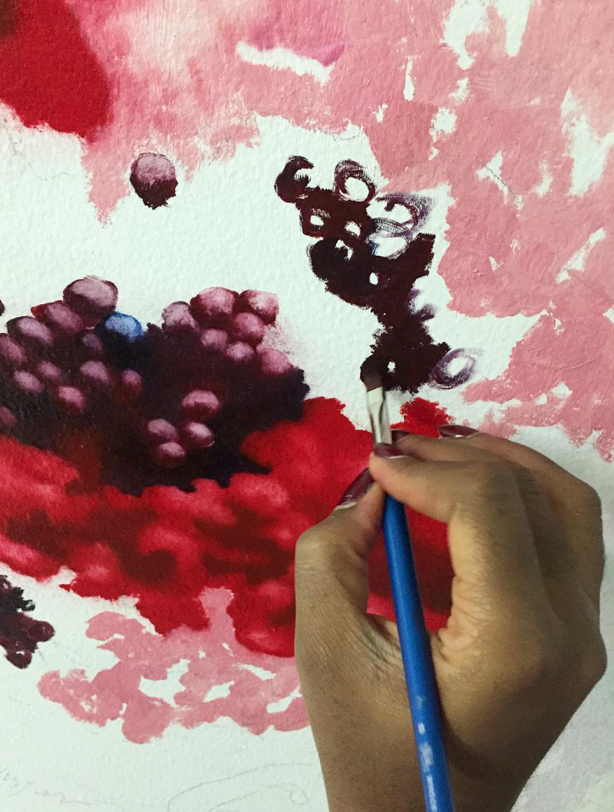 Artist Nengi Omuku working on her wall painting in the Family Room at Eileen Skellern 1 Women's PICU at The Maudsley Hospital