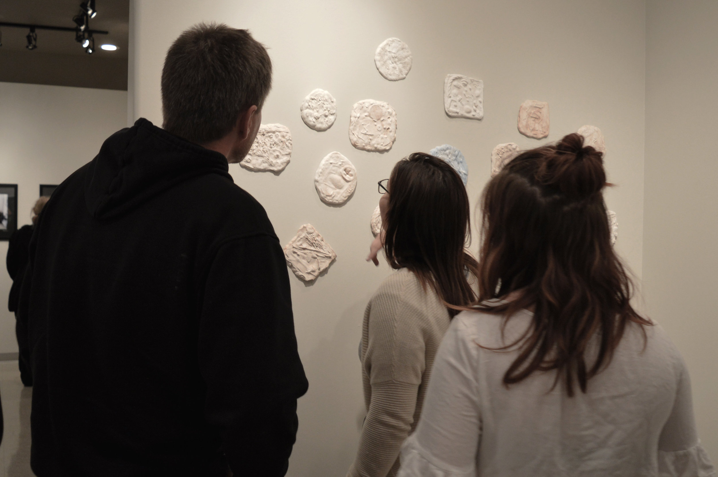 Tidal Resonance Ex people looking at plaster.jpg