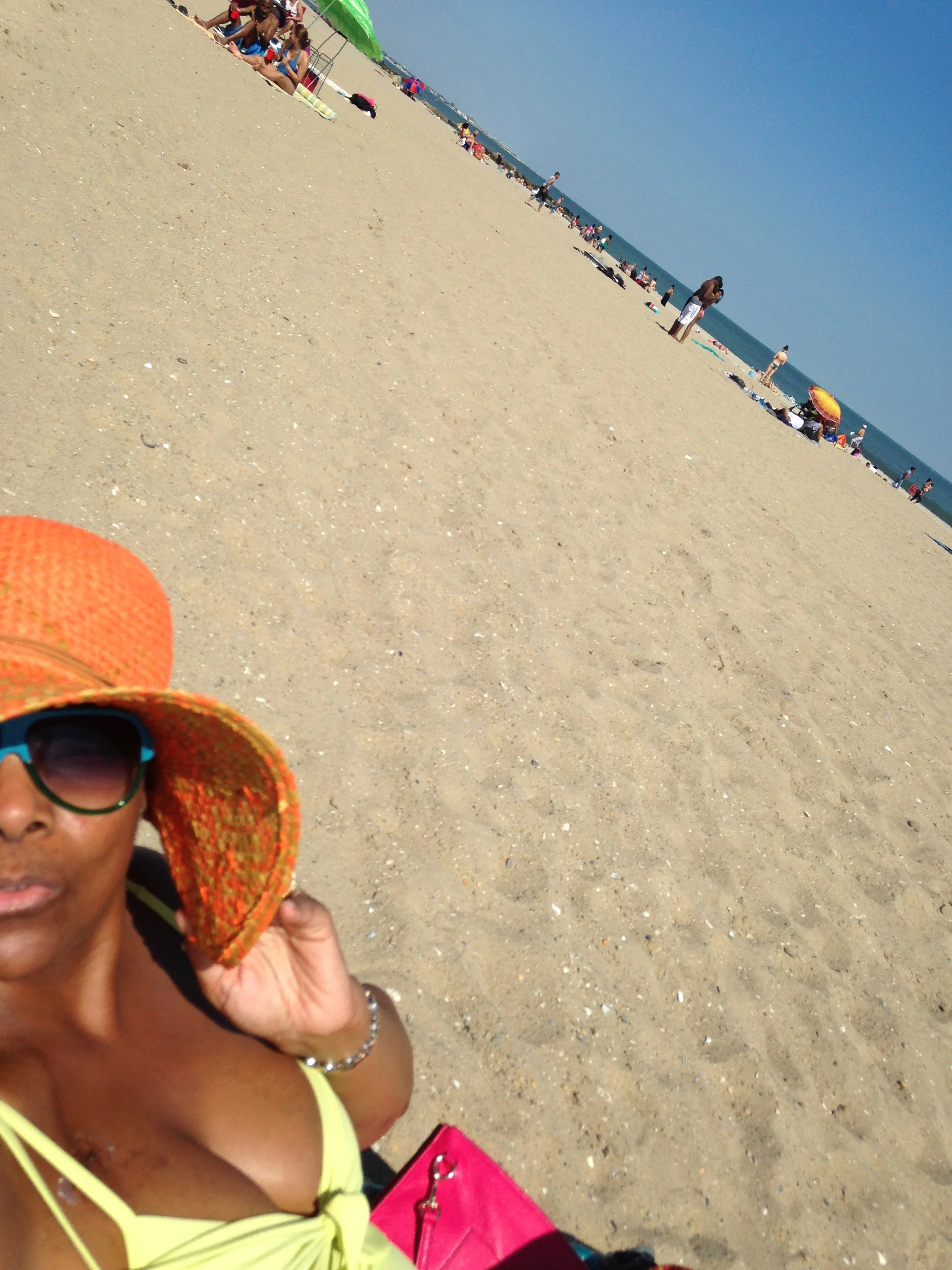 Just finished chemo & had a beach day in The Rockaways. My floppy hat & umbrella were essentials.