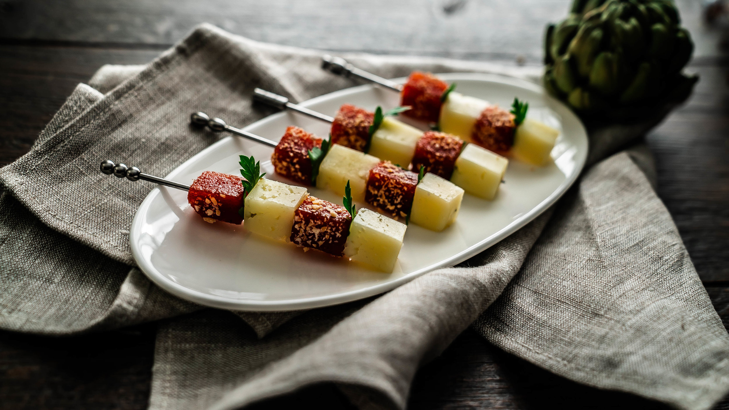 Manchego, quince, and marcona almond skewers