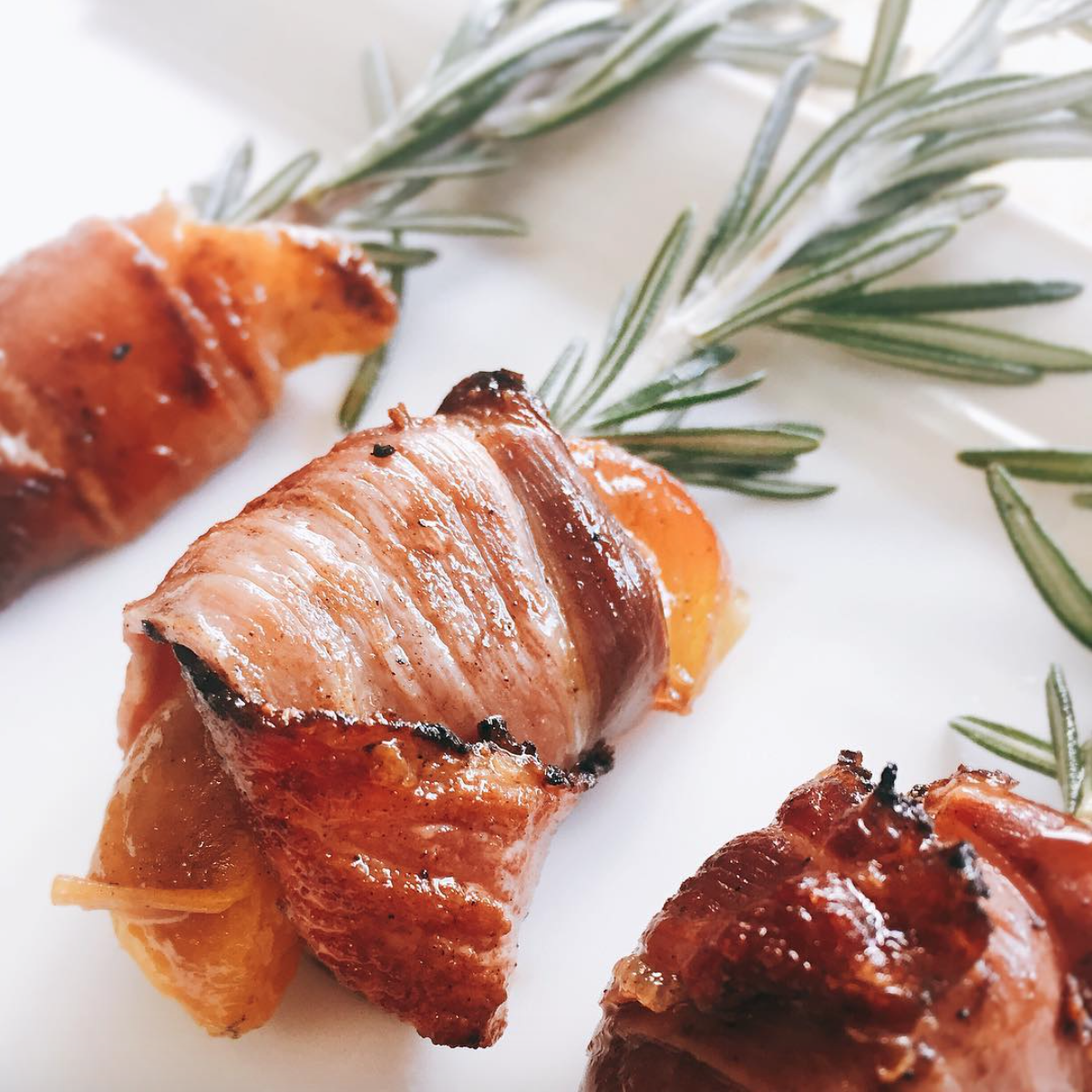 Prosciutto wrapped peaches on rosemary skewers.png