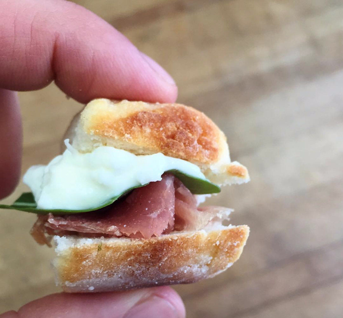Mini buttermilk biscuit with prosciutto, burrata, arugula, and fig.png