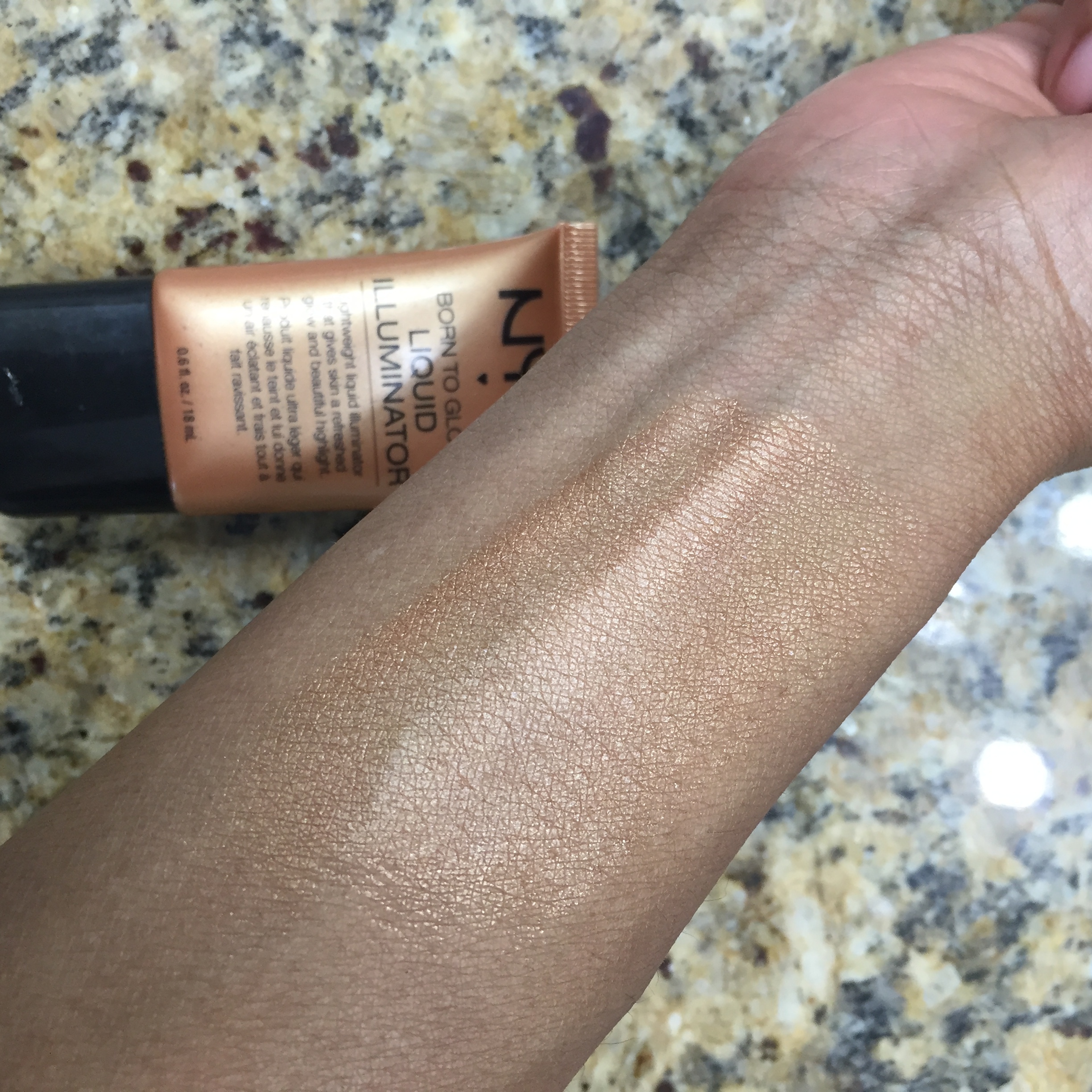 Upon blending the product into my skin, you can see the subtle gold glow that is beginning to enhance my skin.