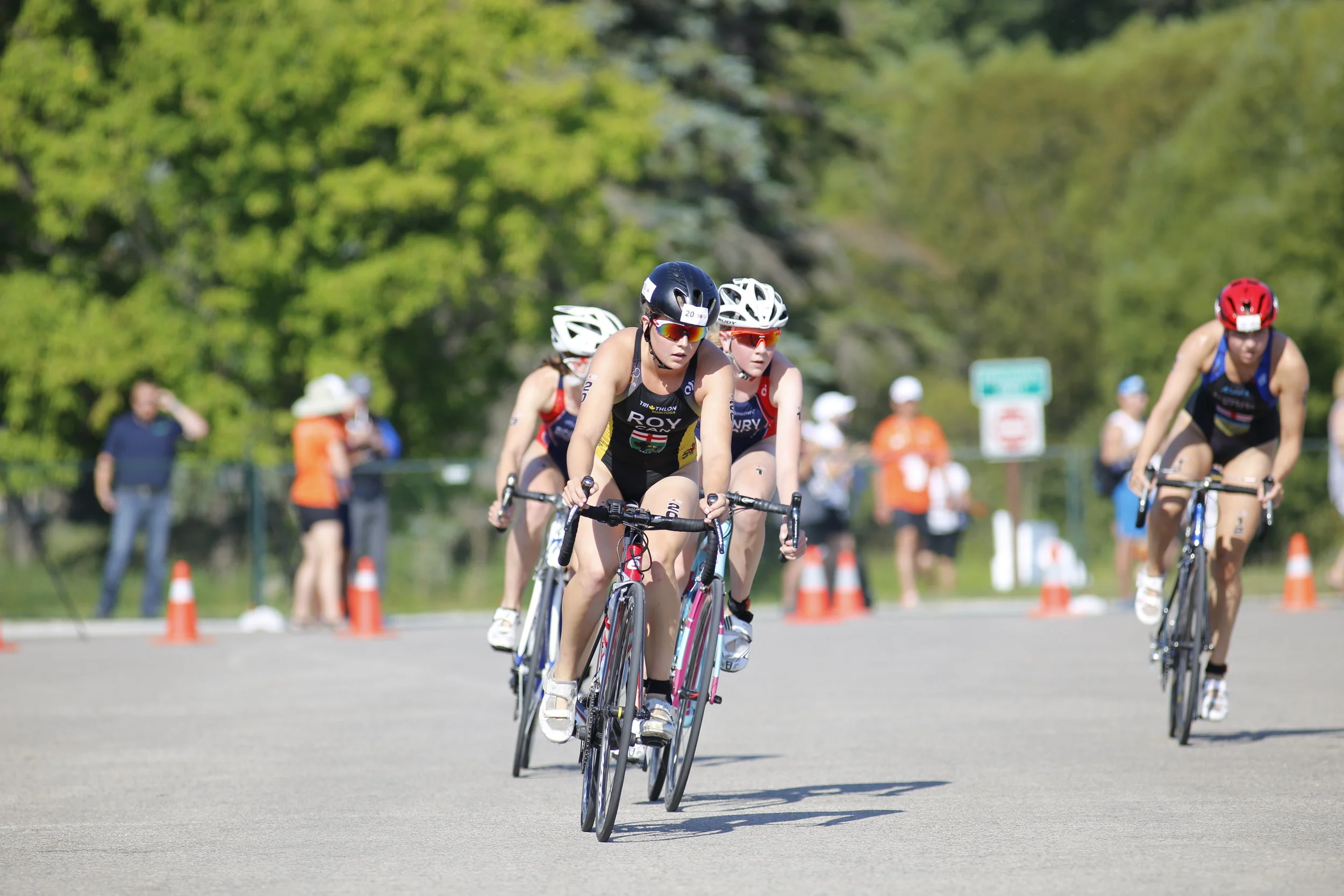  JUSTIN SAMANSKI-LANGILLE / WINNIPEG FREE PRESS Manitoban Kyla Roy leads the peloton during the cycling stage at Monday's women's triathlon at Birds Hill Park. Roy finished third in the competition behind two athletes from B.C. 170731 - Monday, July 