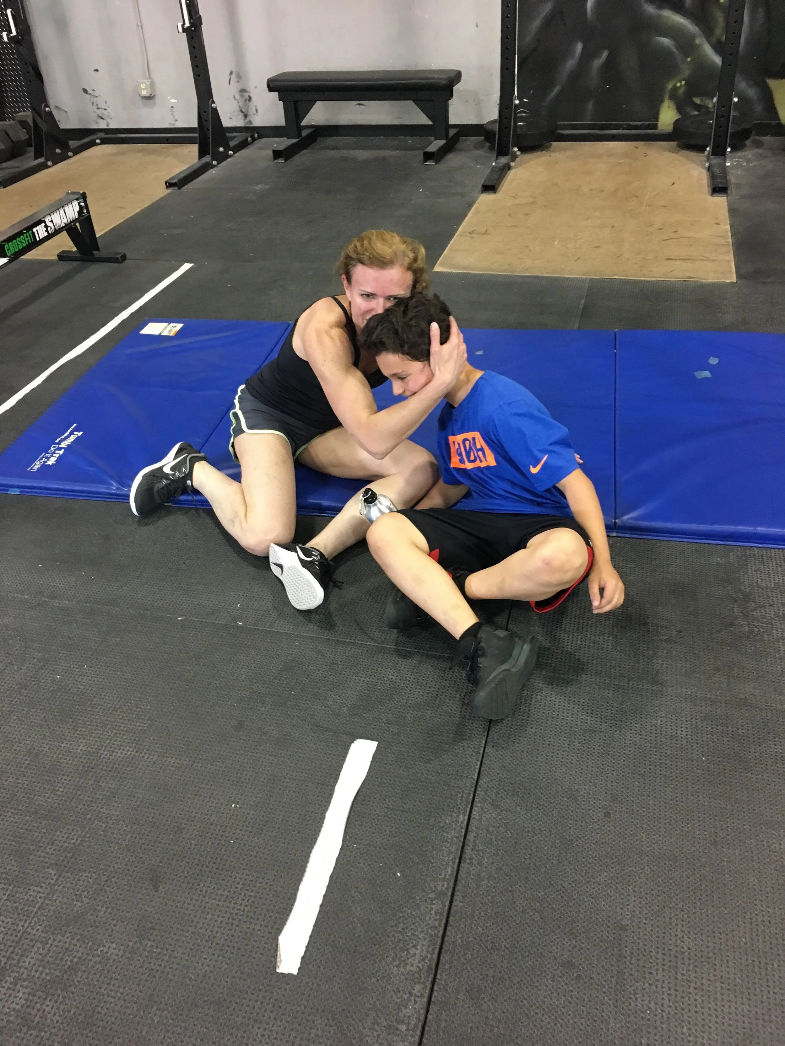 Special moment today captured as a really special mom and son share a post-WOD hug after crushing "Jelly Belly" side by side today. It was AWESOME.