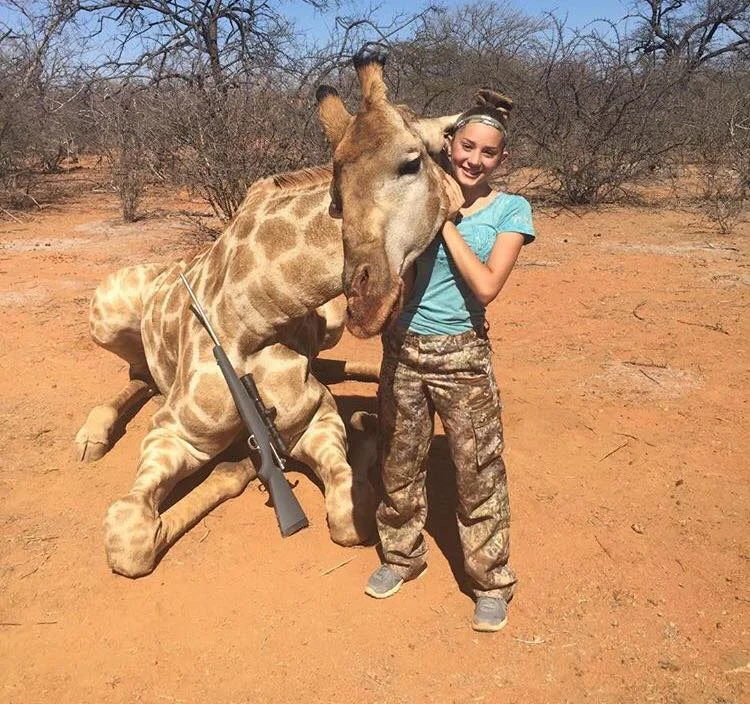 Aryanna Gourdin posing with dead giraffe Credit: Facebook