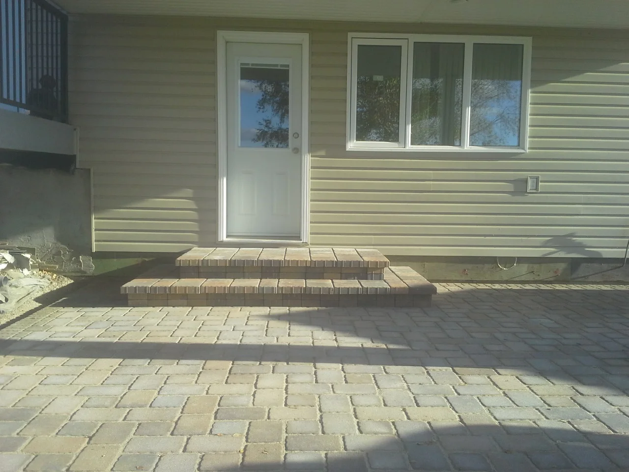 Paving Stone Patio with Stone Step