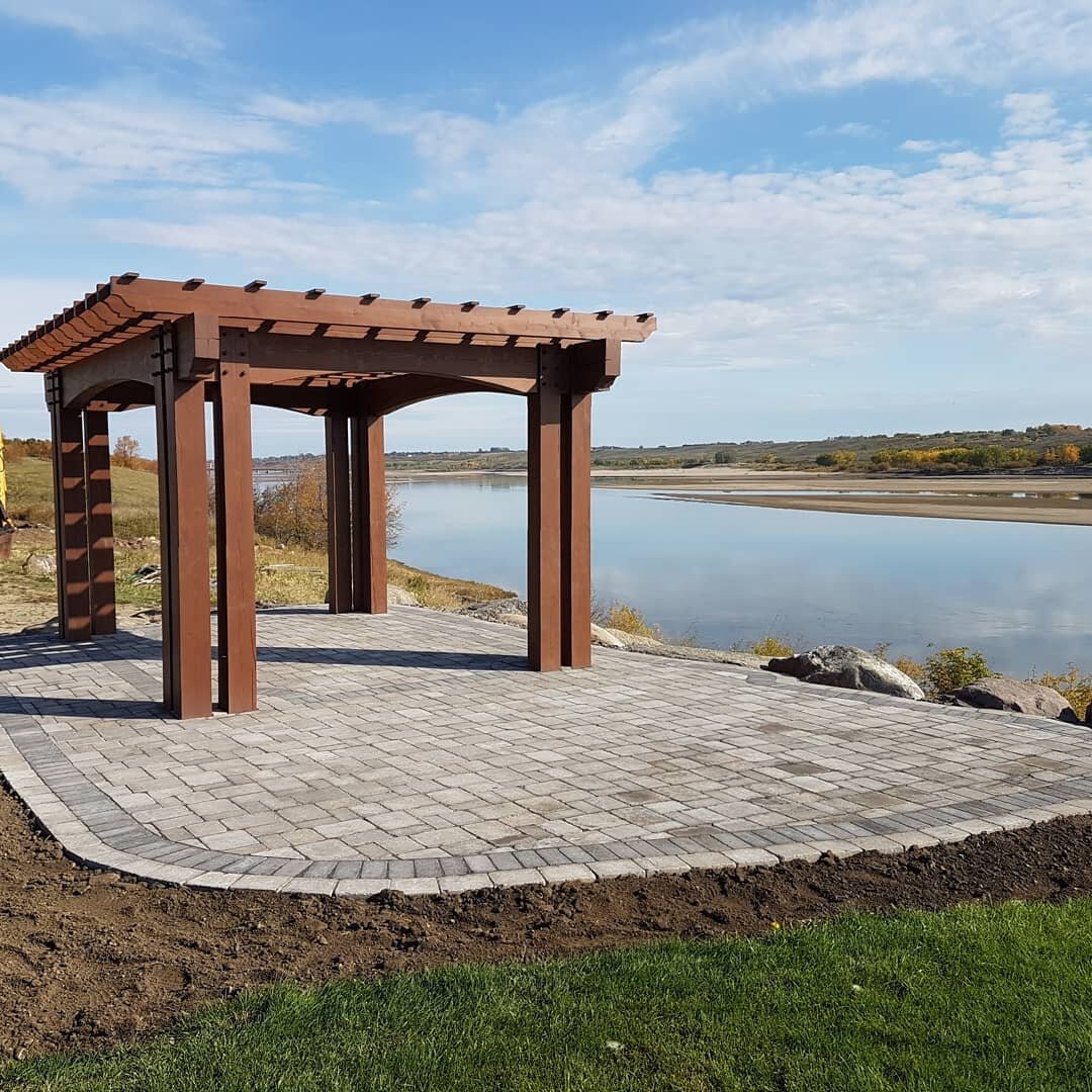 We recently finished this paving stone project and along with the customer are thrilled how it turned out. Kudos to Back Country Log Homes who built and installed the amazing pergola and the owner used local boulders to create a gorgeous terrace for 