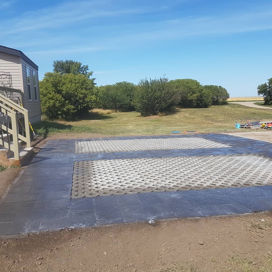 Customer had turfstone. We added a some beautiful Barkman Navaro to create a 2 vehicle parking pad. Can't wait for the grass to grow. #barkmanconcrete #burnco #broderick