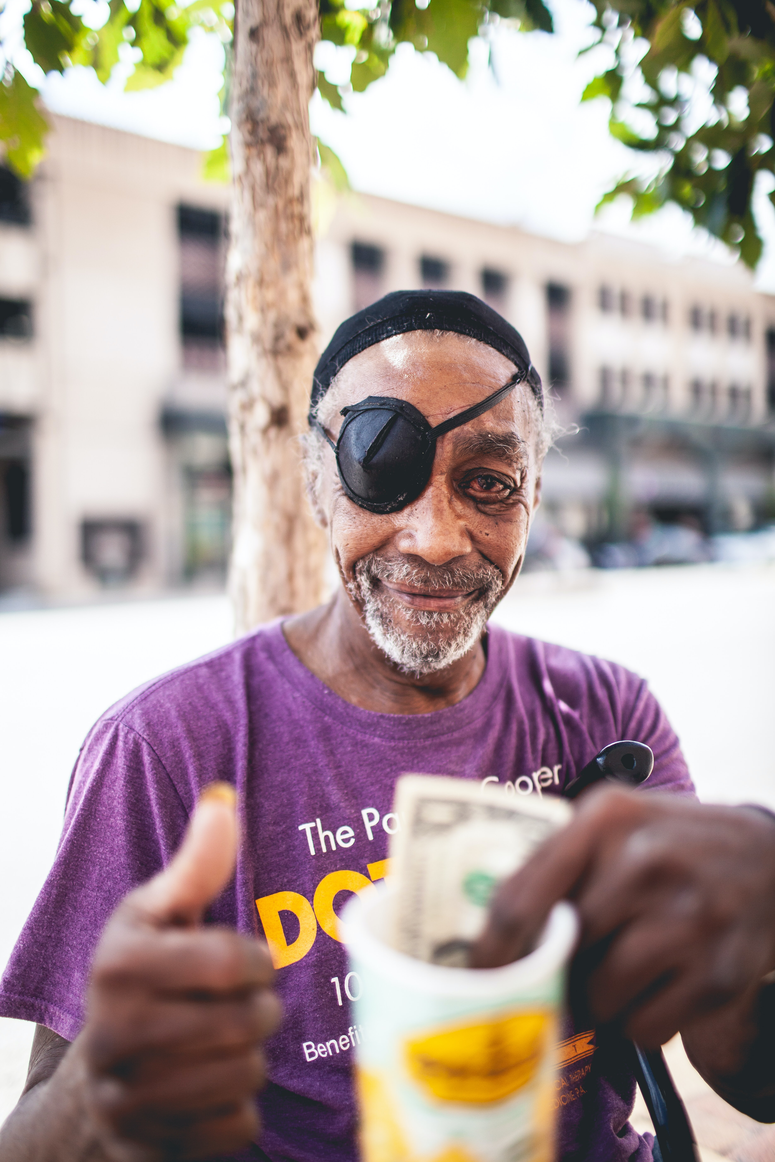 Elderly homeless man smiling