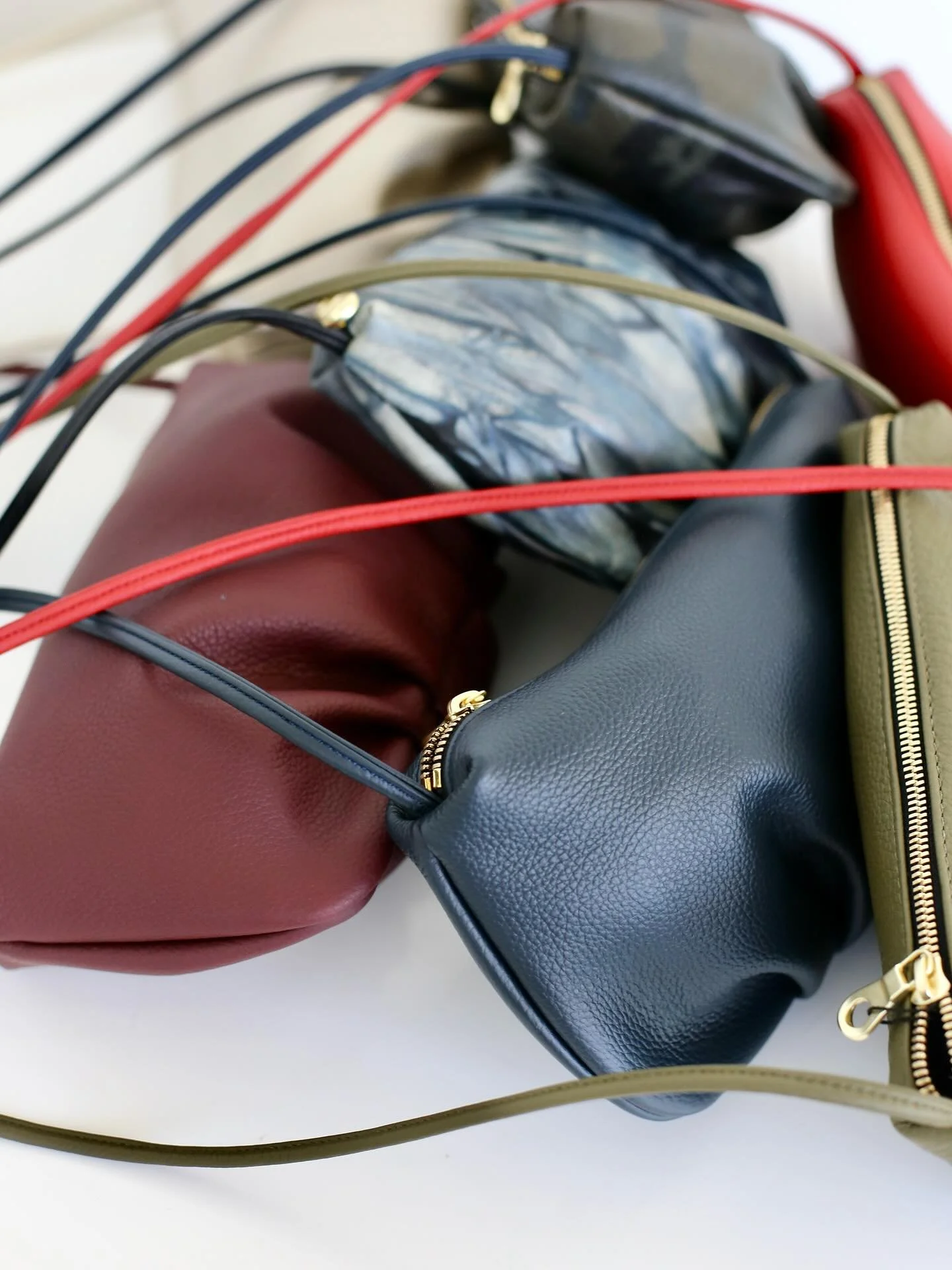 Excited to share the new Jersey Girl colors&mdash;Presidio Blue, Camo, Platinum, Sonoma Wine, and the hand-painted Truckee River Tie Dye. The pleated detail looks beautiful in every tone, with a slim strap you can knot for shoulder, crossbody, or car