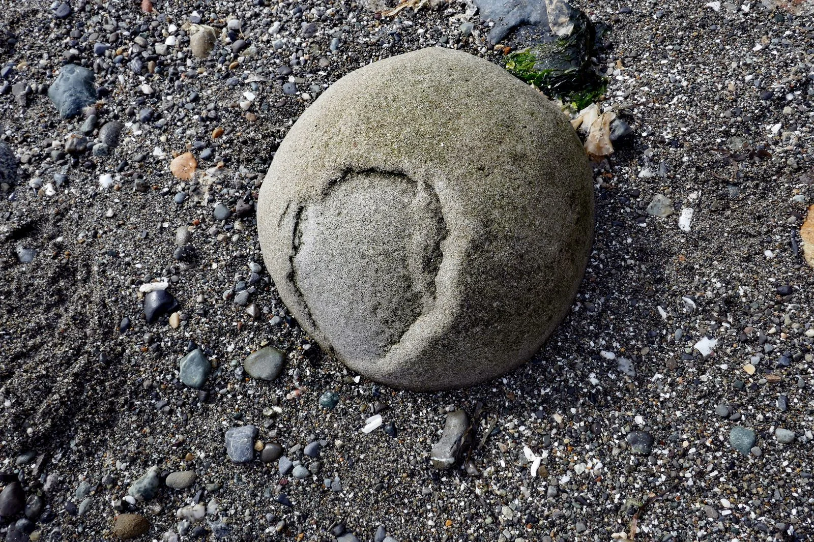 Bowling ball size nodule with soft outer layer that is eroding