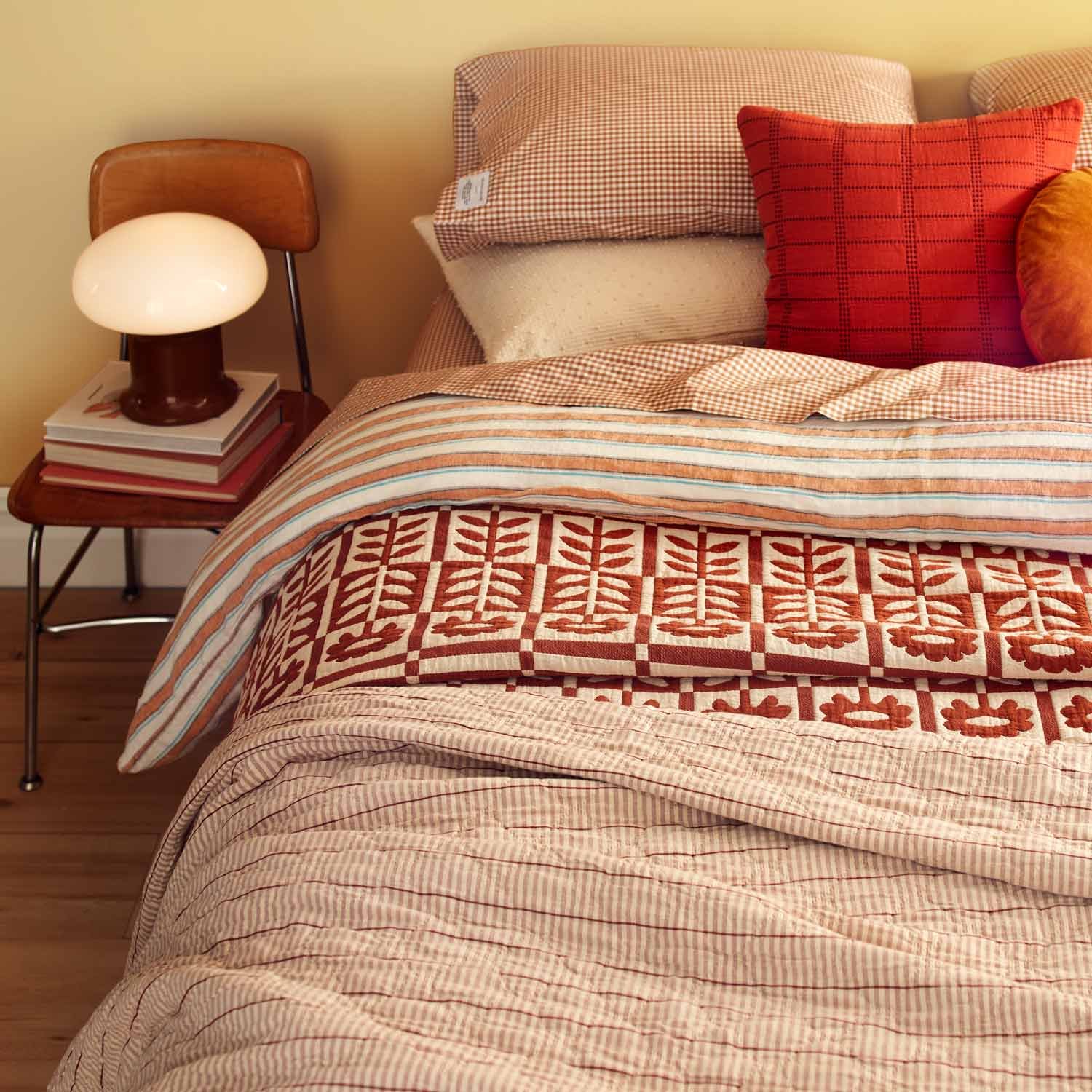 2023-1213_schoolhouse-spring-preview_spread-307-quilts-warm-version_bedroom-feature-v3_diamond-ticking-quilt_rospo-table-lamp_jim-bastardo-859_web.jpg