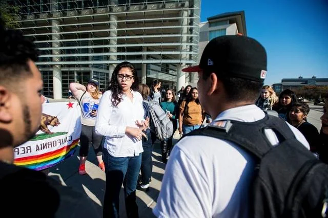 Florence Lucey-Renteria, 19, a University of California, Merced, sophomore and President of Women in Science, Technology, Engineering and Math or WSTEM, gathers with fellow UC students to protest the policies of President-elect Donald Trump outside the Kolligian Library on campus in Merced on Nov. 9. Andrew Kuhn akuhn@mercedsun-star.com