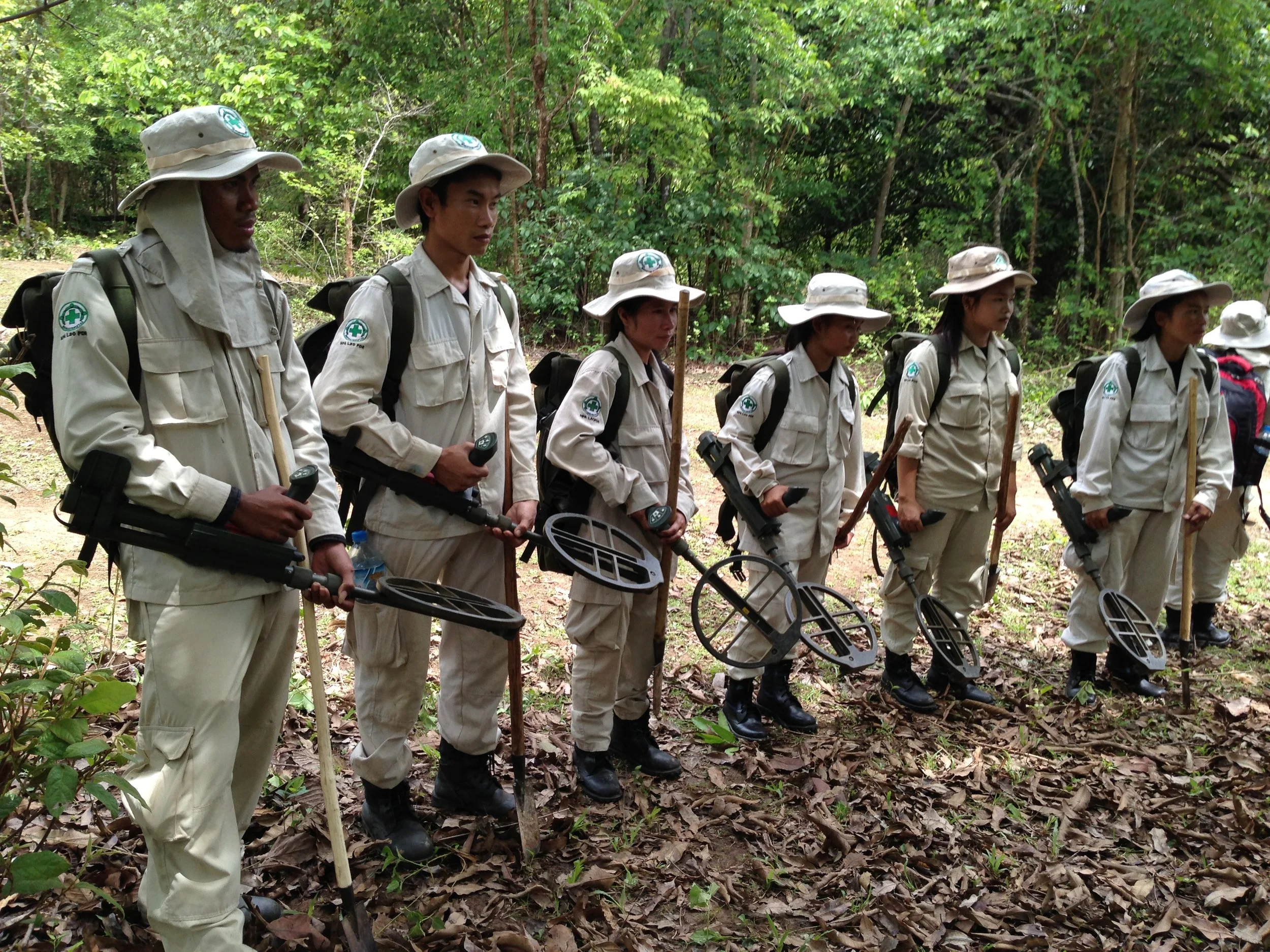 Laotian deminers, part of a Norwegian NGO in the jungles of Laos. Photo: Mike Blanchfield