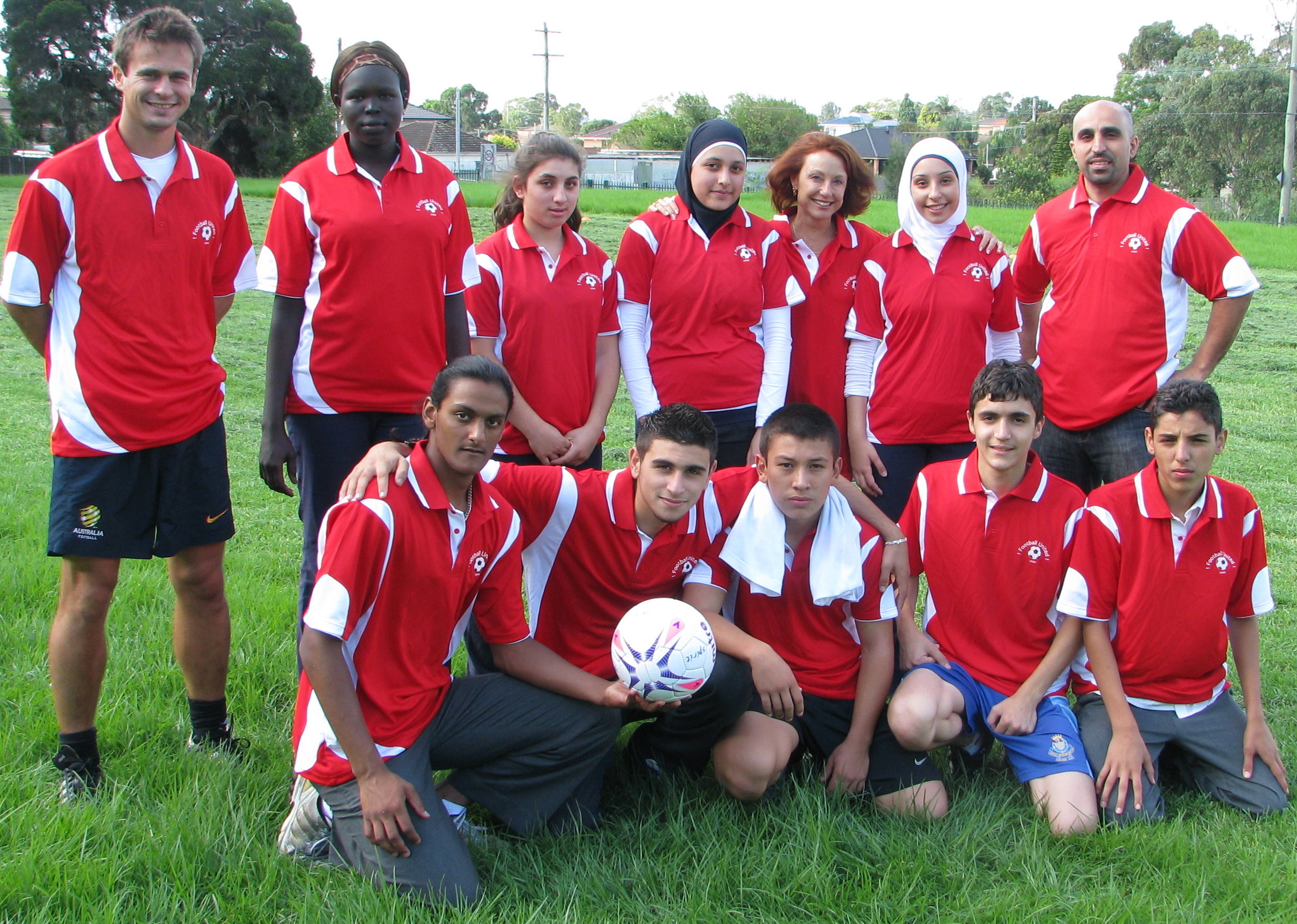 Football United Coaches with teacher Ali Nagi, Coach Kai Lammert and Founder Anne Bunde-Birouste