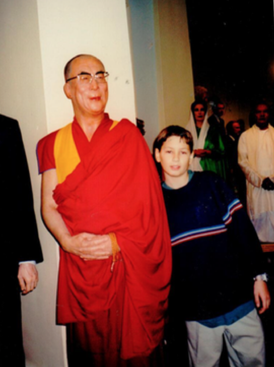 Posing with his holiness the Dalai Lama at Madame Tussaud's in London