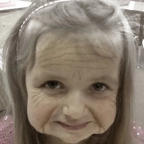 A picture taken with Aging Booth. This makes a fun portfolio page if you save the pictures and have the kids write about what the world will be like when they're 100 underneath the photo.