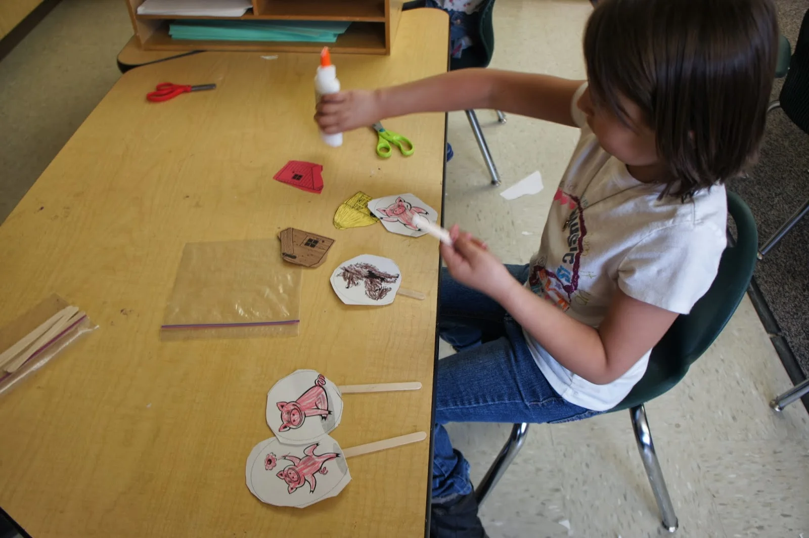 We make puppets to help retell familiar stories.