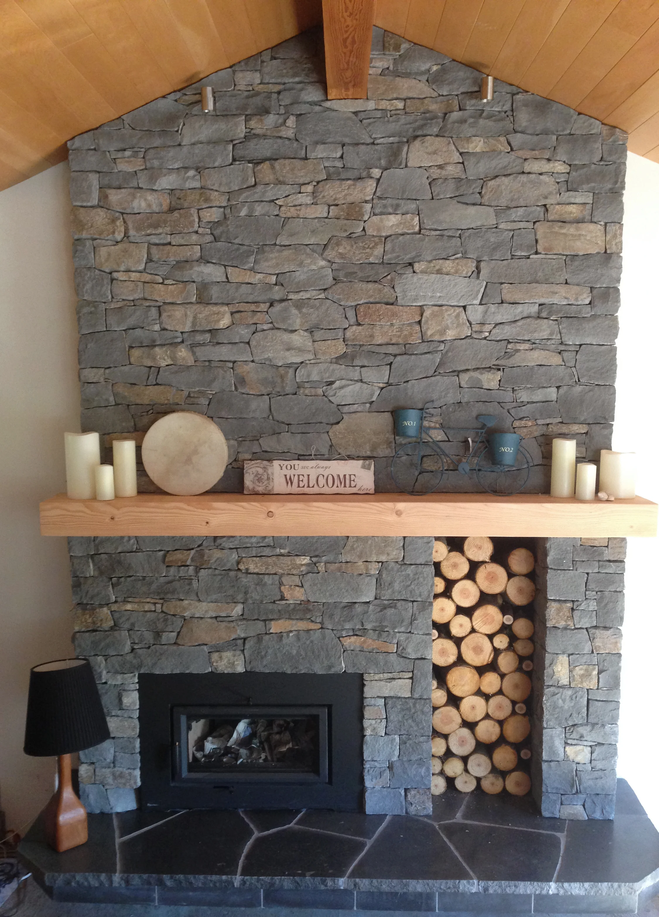 Basalt fireplace with Douglas fir mantel and polished basalt slab hearth, Whistler