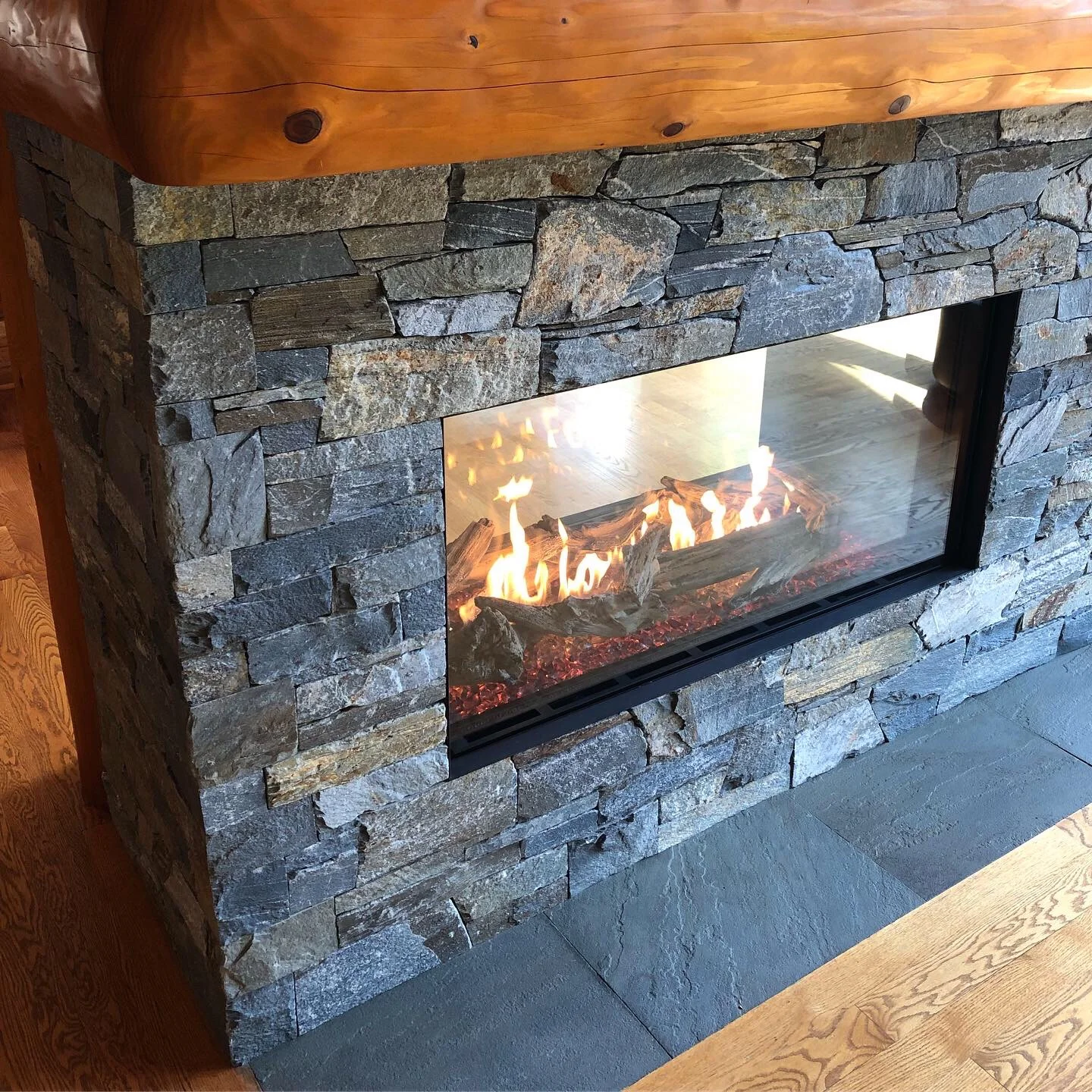 Double-sided fireplace in Whistler lodge style home