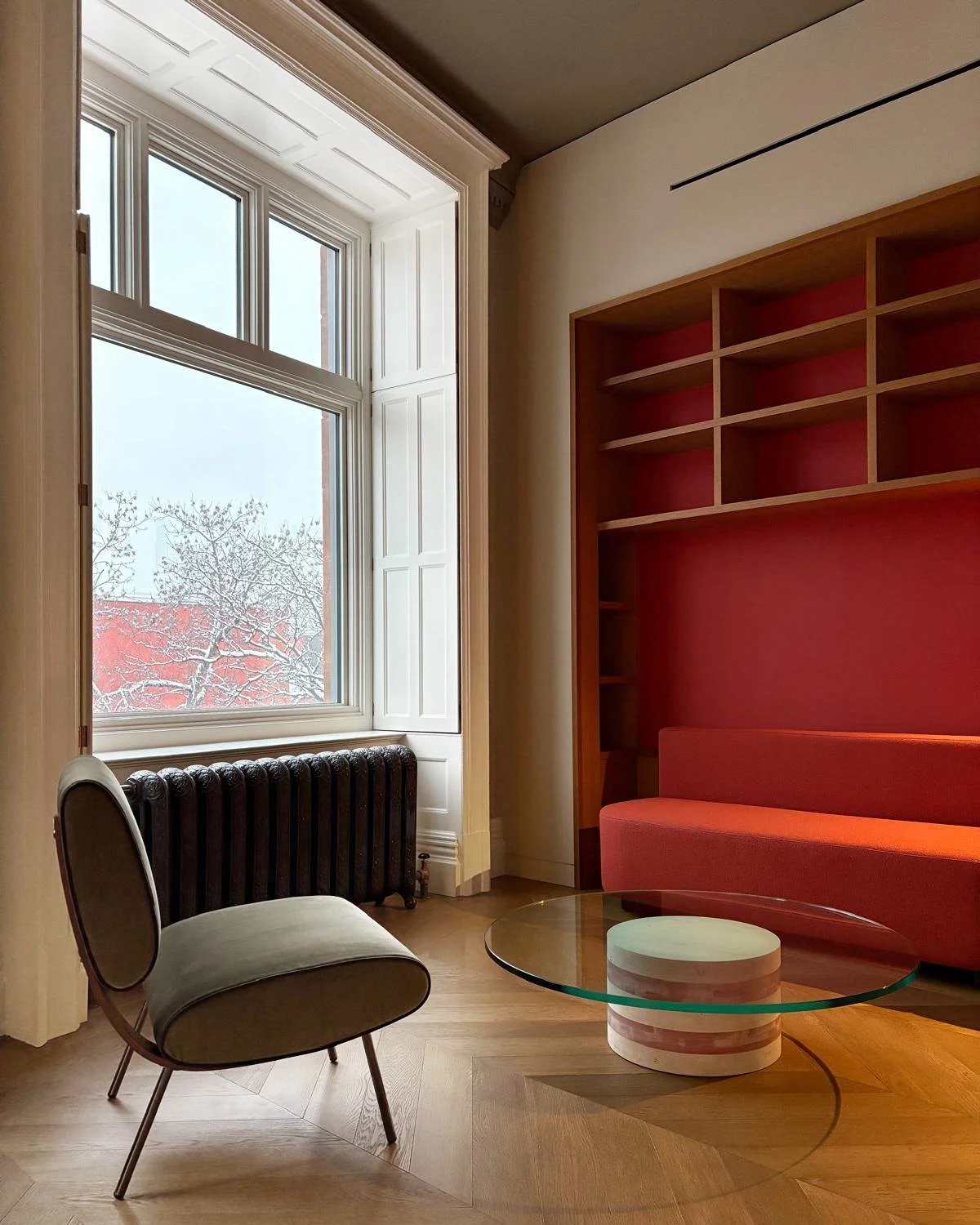 Round chair by Gio Ponti and Architexture coffee table by Patricia Urquiola