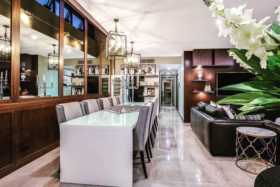 Stone floors were laid throughout the main areas of the apartment and cabinet work was designed and made out of toasted solid oak. The new panelled mirrors on the rear wall help to create the feeling of openness, but also bring the view of the city scape inside. At night the city lights that are reflected in the mirrors, this creates a spectacular backdrop in the Dining area. The new furniture and soft furnishings were selected in a neutral pallet that is warm and inviting, and the furniture, is a classic, contemporary mix of styles. To see the finished apartment now, you realise what an amazing transformation has taken place, its one of those projects you had wished you'd taken a before photo of the old interior. To show the extent of what has taken place, and the stylish interior that has now been created.
