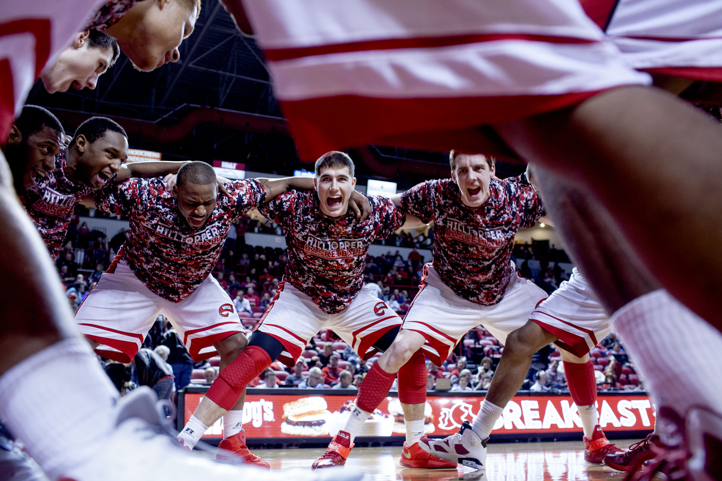 The Hilltoppers chant together in a huddle before WKU's 65-59 win over North Texas on Thursday, Feb. 5, 2015, at E. A. Diddle Arena in Bowling Green, Ky.