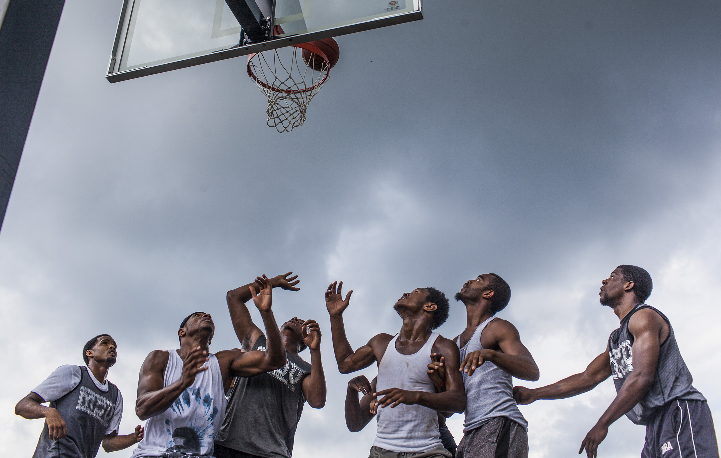 Players compete in a 5 vs. 5 dust bowl during the 30th annual Emancipation Day celebration on Saturday, Aug. 6, 2016, at Hampton Park in Russellville, Ky.