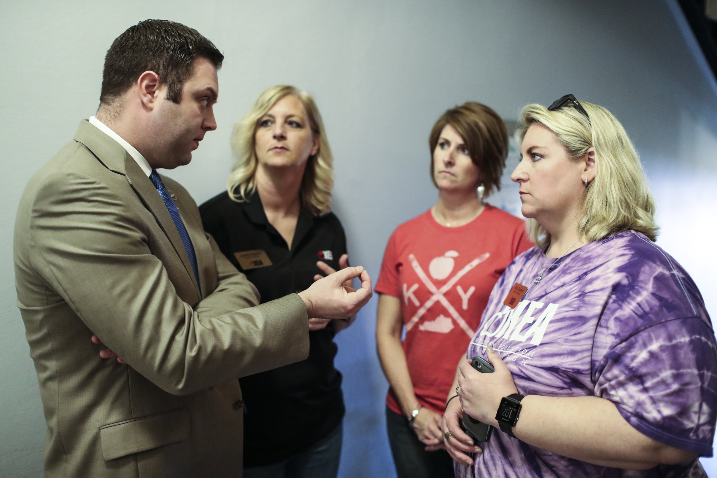 From right, Kim Coomer, Career Specialist at Warren County ATC, Kelley Ross, AP English teacher at Barren County High School, and Jennifer Hawkins, preschool teacher at Cumberland Trace Elementary School talk to state Rep. Michael Meredith, R-Brownsville, on Friday, April 13, 2018, at the Kentucky State Capitol.