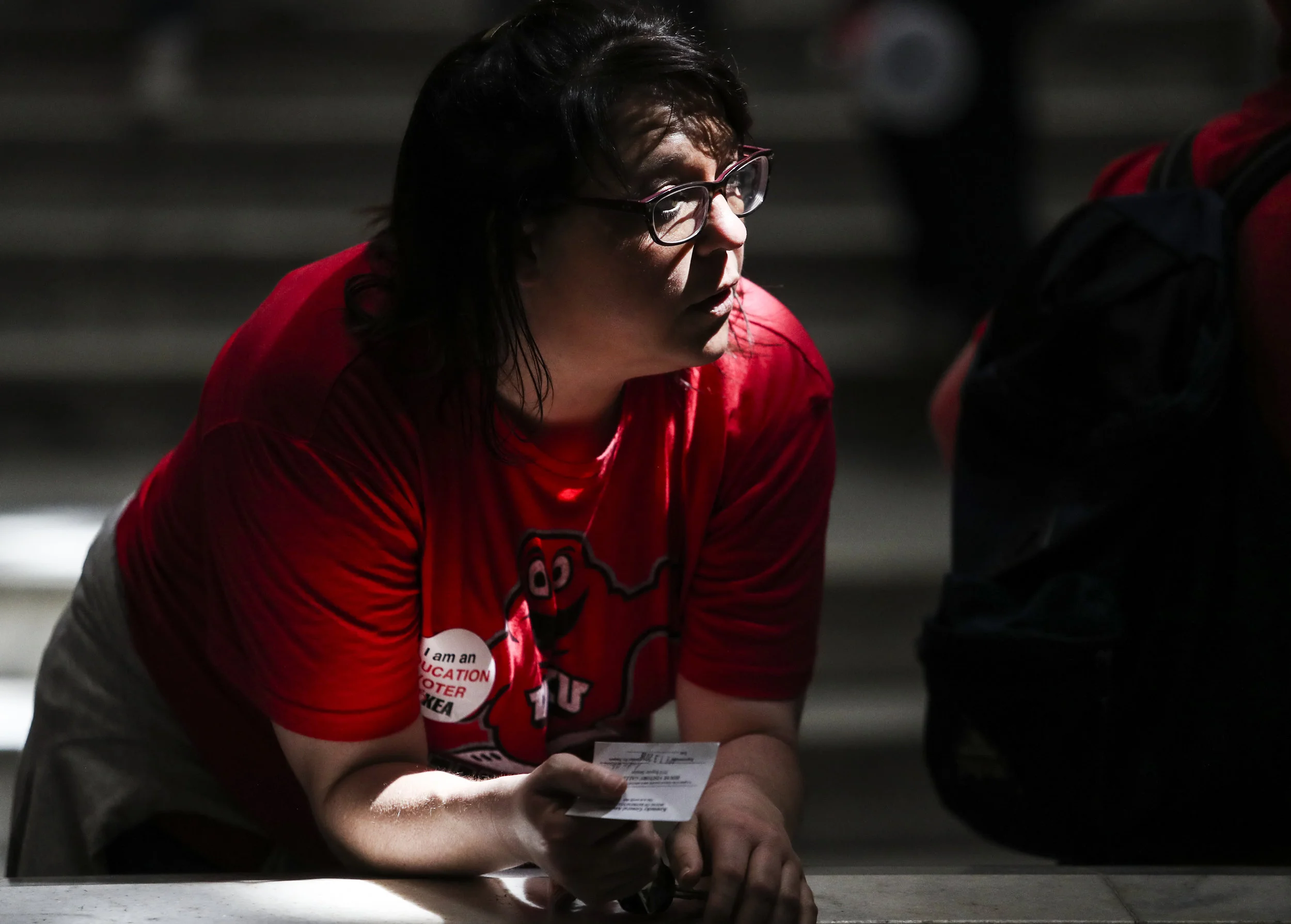 Samantha Ficks, an elementary school teacher in Jefferson County, Ky., rests on a railing inside the Capitol on Friday, April 13, 2018, at the Kentucky State Capitol.