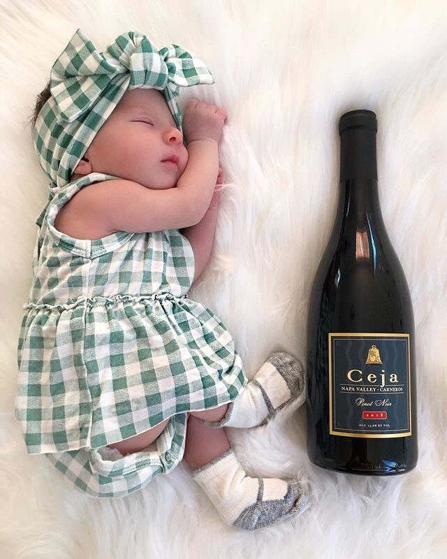 ✨ Weekend vibes ✨ Excited to be able to enjoy my vino + bubbles again! My parents took a picture of me like this when I was born so I wanted to continue the tradition with my favorite bottle of @cejavineyards Pinot Noir. We&rsquo;ll be toasting to a 