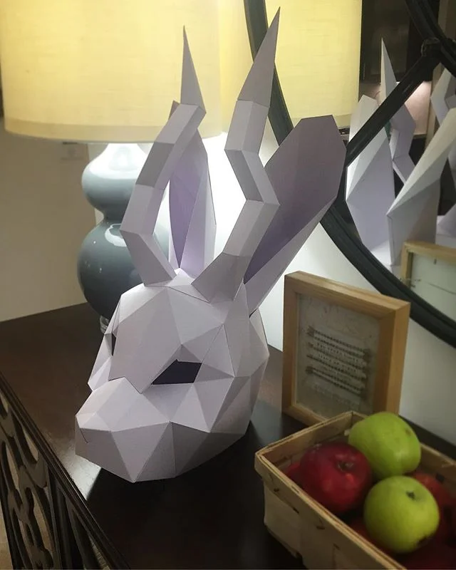 Having trouble parting with these bad boys from Halloween... considering adding fairy lights and turning them into lamps? #totallywouldntbecreepy #paperart #papermask #papercraft #lowpolymask #jackalope #lowpoly #lapastudios 
Jackalope template: @lap