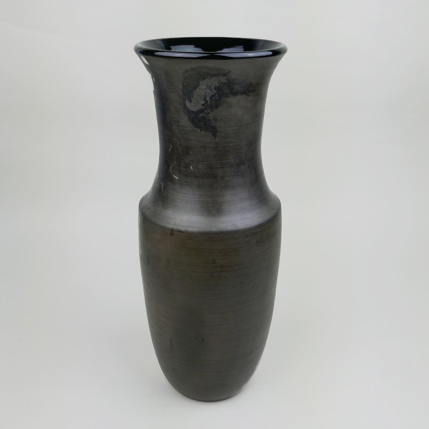 I&rsquo;m very pleased that this piece has been selected to be part of the @throwncontemporary gallery&rsquo;s Winter Exhibition. 

Black Mirror vase, 30cm high. Wheel thrown then pitfired with reused and foraged organic material (including sawdust, 