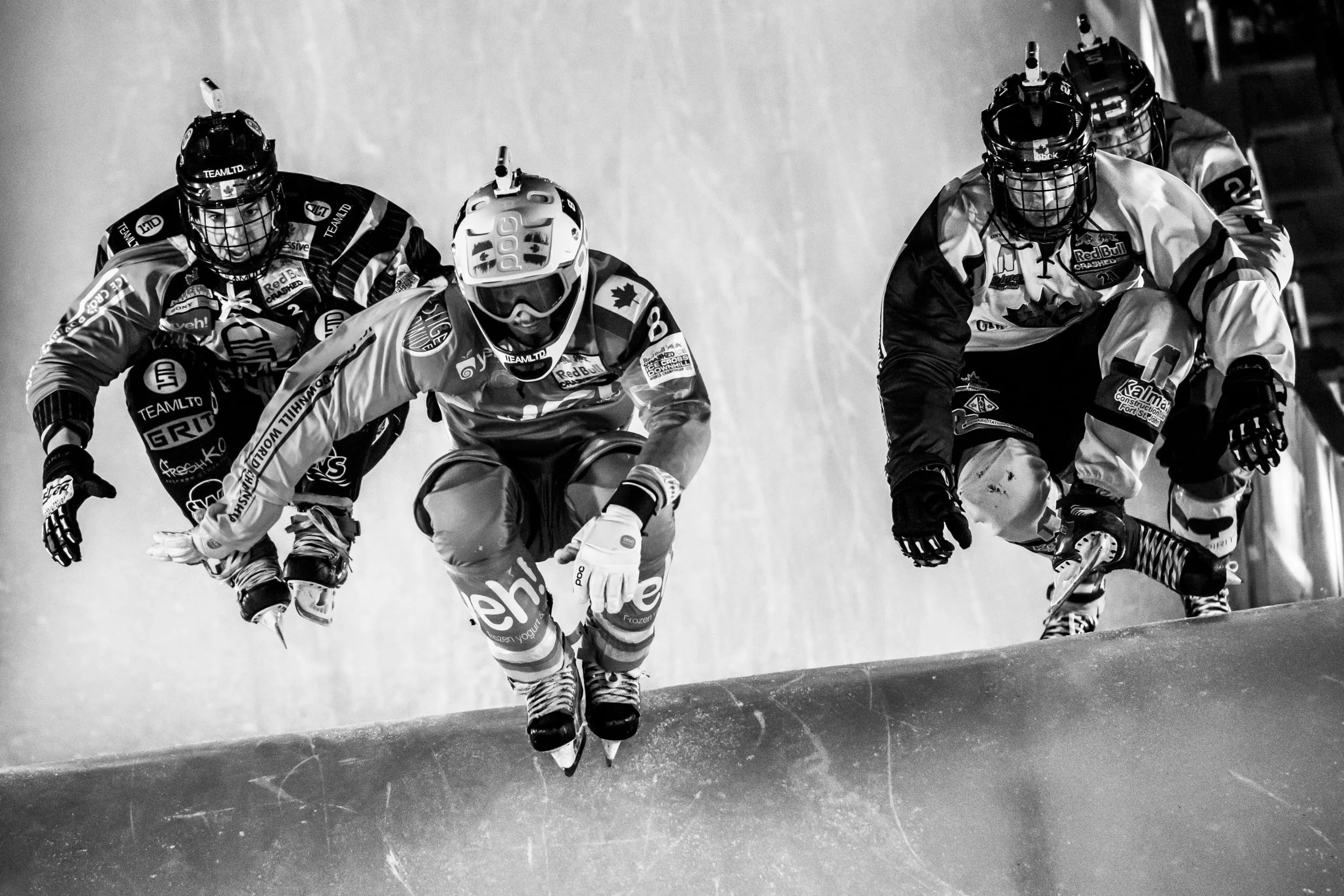 Scott Croxall of Canada, Dean Moriarity of Canada, Adam Horst of Canada and Paavo Klintrup of Finland compete during the fourth stage of Red Bull Crashed Ice, the Ice Cross Downhill World Championship in Edmonton, Canada on March 14, 2015