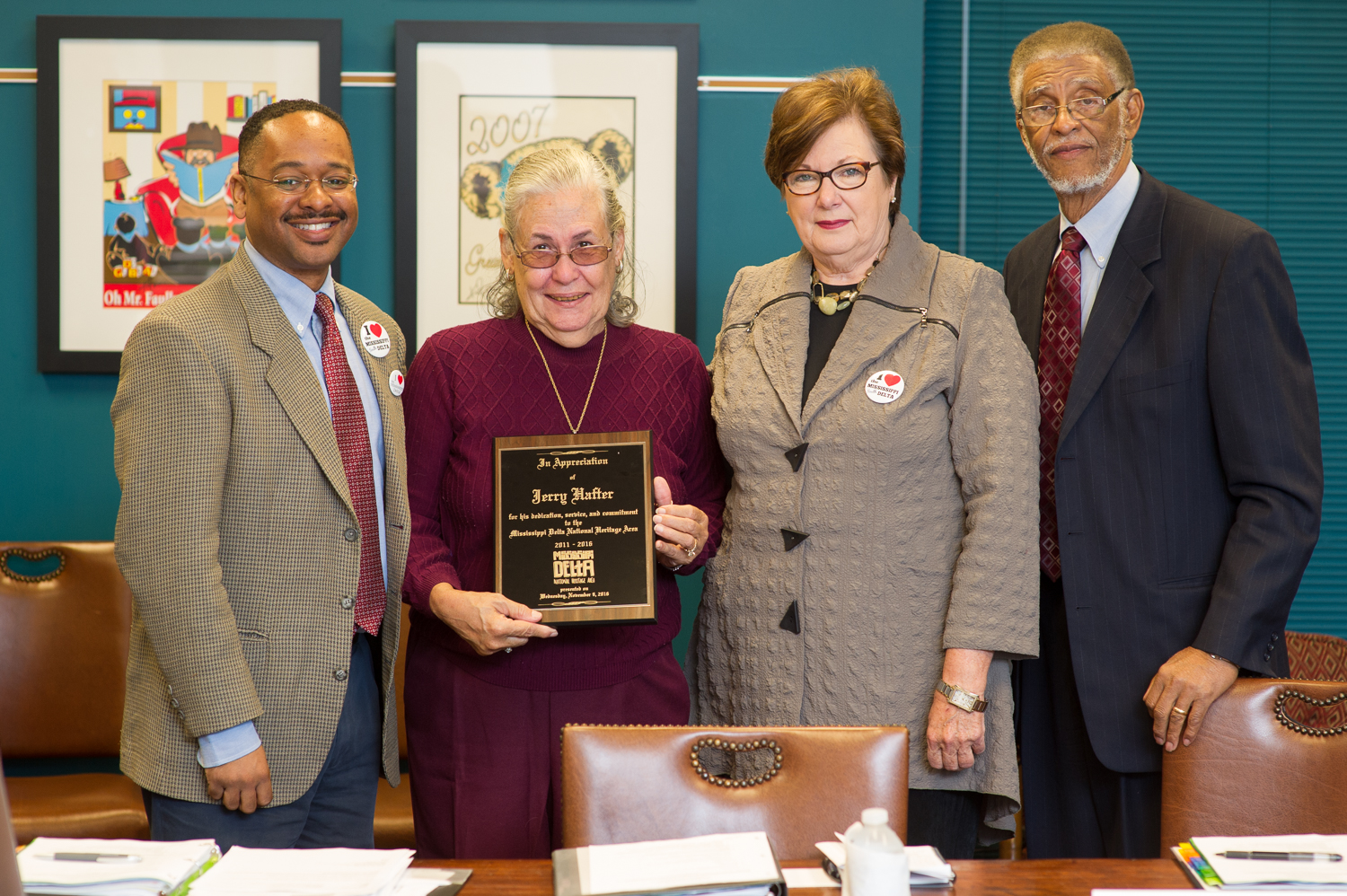 Jocille Hafter accepts a plaque from the Mississippi Delta National Heritage Area in honor of her husband Jerry Hafter's contributions to the MDNHA. She is pictured here with Dr. Rolando Herts, Dr. Myrtis Tabb, and Spencer Nash.